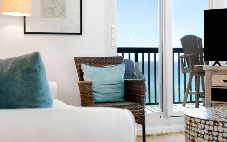 Relax in your bright living space with coastal charm and step onto your private balcony for fresh ocean air.