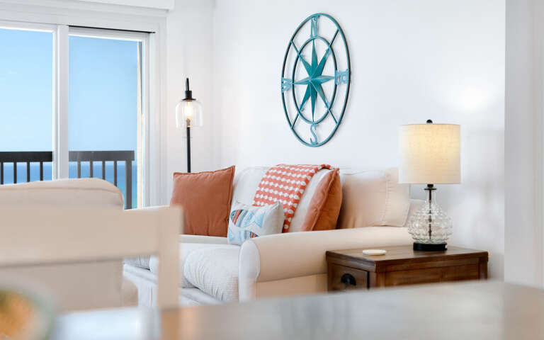 Sink into this coastal living room where ocean views meet comfort. Nautical touches and warm pillows create your perfect seaside retreat.