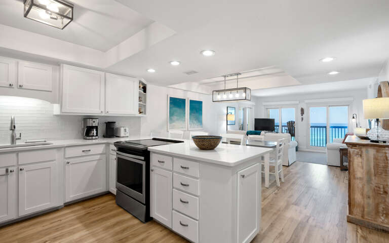 Your spacious kitchen flows seamlessly into the living area, where you'll love cooking with ocean views through the large windows.