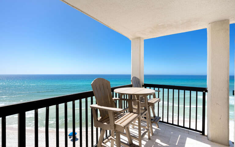 Sip your morning coffee on this private balcony while turquoise waves stretch endlessly before you.