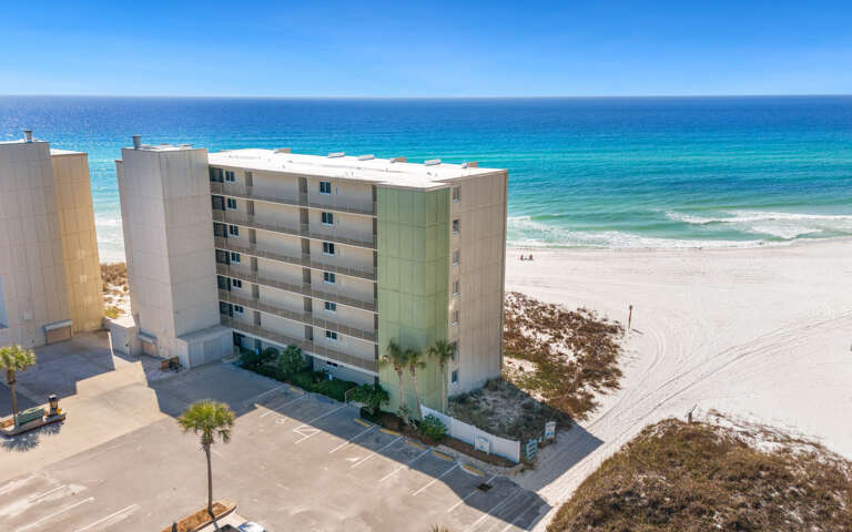 Beachfront property offering direct access to pristine white sand and crystal-clear Gulf waters.
