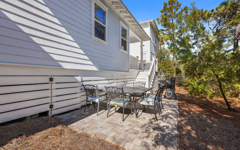 Your private patio offers the perfect spot for morning coffee or evening gatherings under dappled shade.