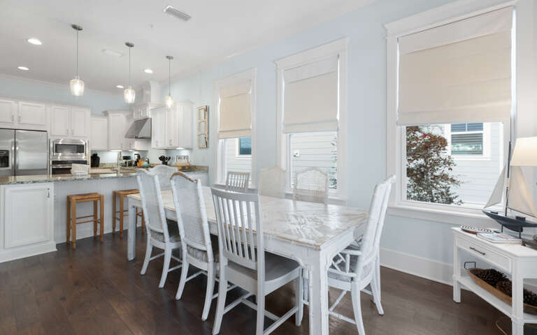 Your bright, open kitchen flows seamlessly into the dining area, where you'll share memorable meals at the stunning marble table.
