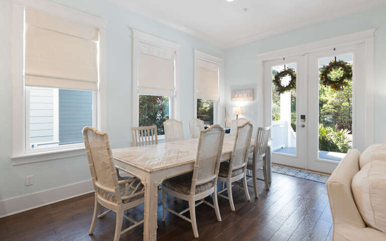 Gather around this elegant dining table where shared meals become cherished memories, with French doors opening to your private outdoor retreat.