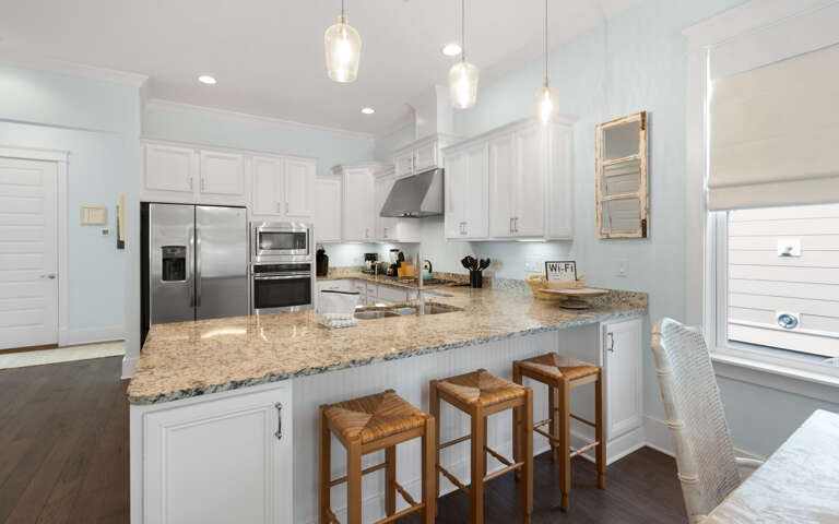 Step into your bright, modern kitchen where granite counters and stainless appliances await your culinary adventures.