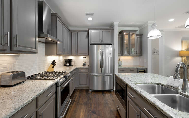 Your fully equipped kitchen features granite counters, stainless appliances, and everything you need to create memorable meals together.