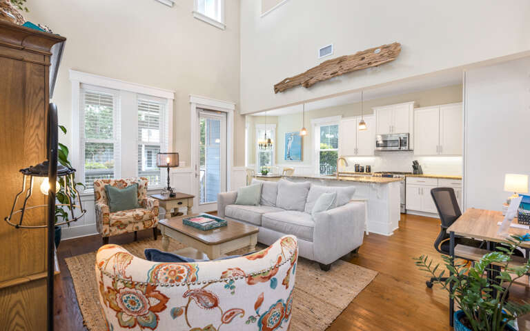 Living Room With Sectional Sofa And Open Kitchen Area