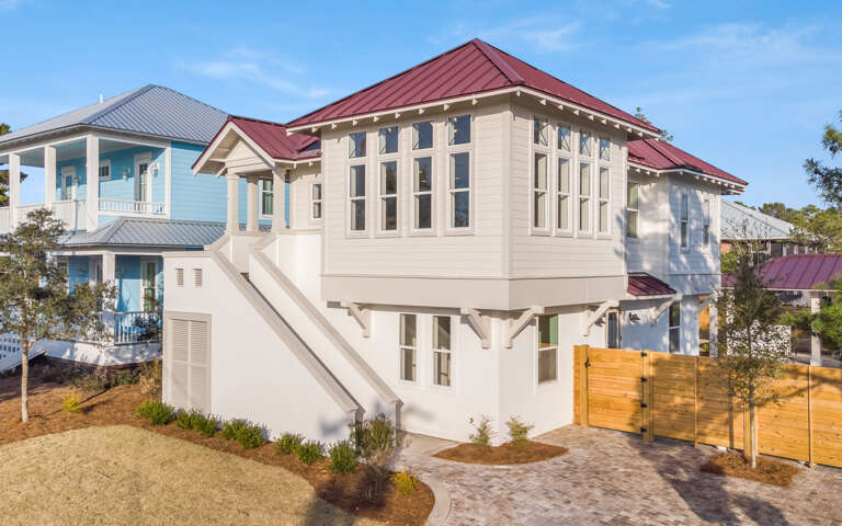 Residential House With Stairs And Fenced Yard