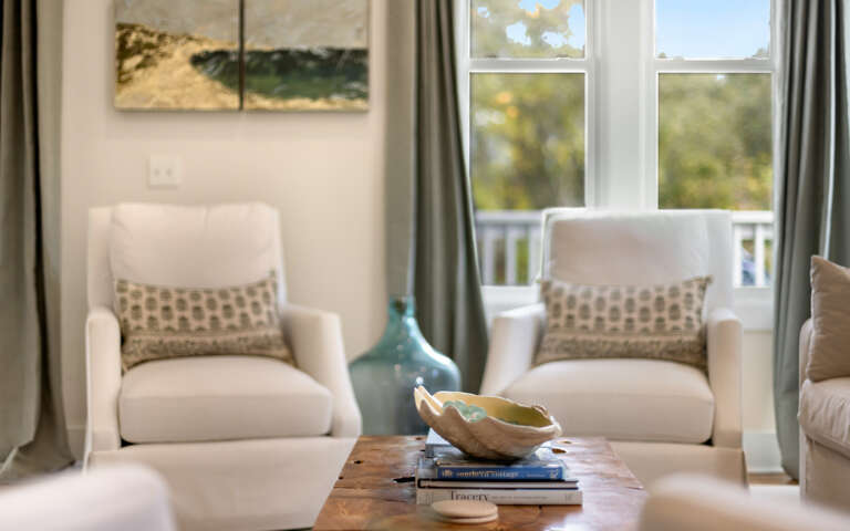 Settle into plush chairs by bright windows where natural light creates the perfect reading nook for your peaceful getaway.