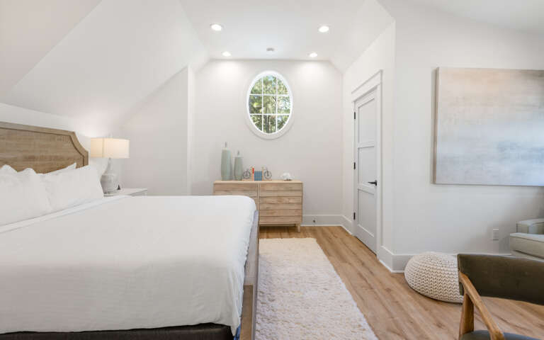 Serene Sleeping Space Showcasing Simple Style, Sleek Surfaces, And Symmetrical Setup