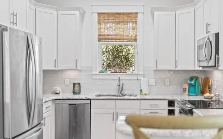 White Kitchen Interior With Stainless Steel Appliances White Kitchen Interior With Stainless Steel Appliances