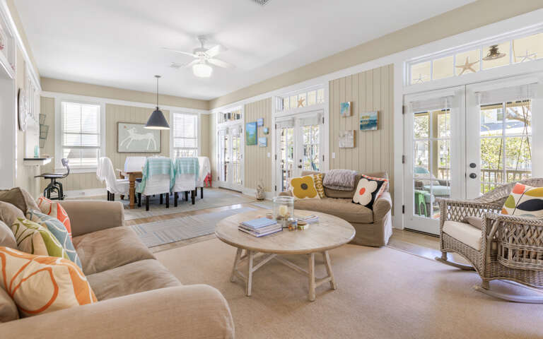 Bright Living Room With Sofas And Dining Area