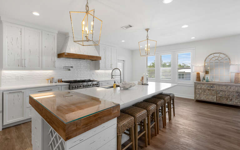 Bright Kitchen Interior With Island And Dining Area Bright Kitchen Interior With Island And Dining Area