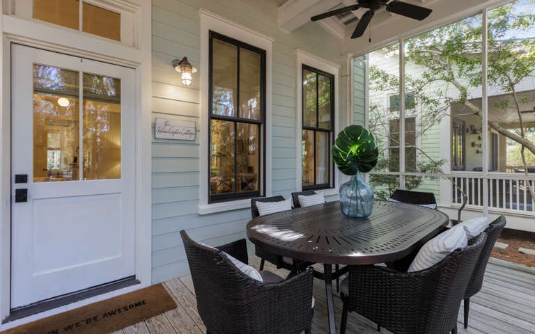 Patio Table, Wicker Seats, White Doors, Woody Backdrop