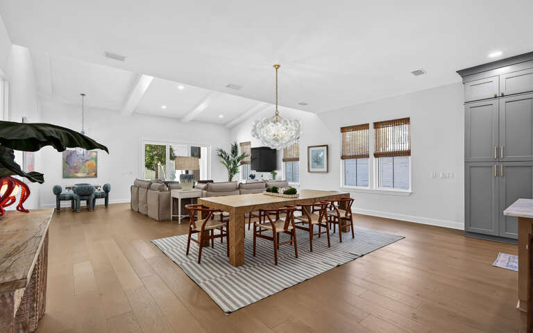 Unwind in this stunning open-concept space where natural light floods your dining and living areas through oversized windows.