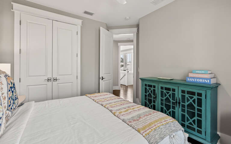 Sink into crisp white linens and enjoy the peaceful ambiance of your private retreat, complete with charming coastal-inspired furnishings.