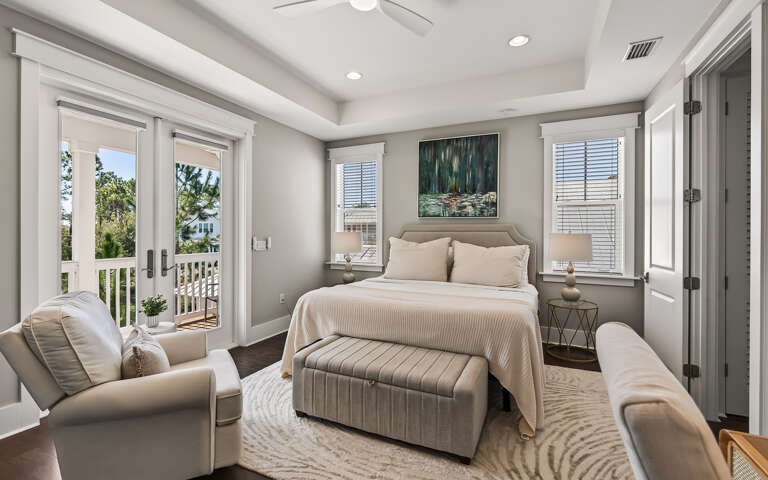 Your serene bedroom sanctuary features premium linens and private balcony access, creating the perfect retreat for peaceful mornings and restful nights.