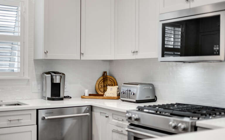 Your bright kitchen comes complete with modern appliances and thoughtful touches, ready for your culinary adventures.