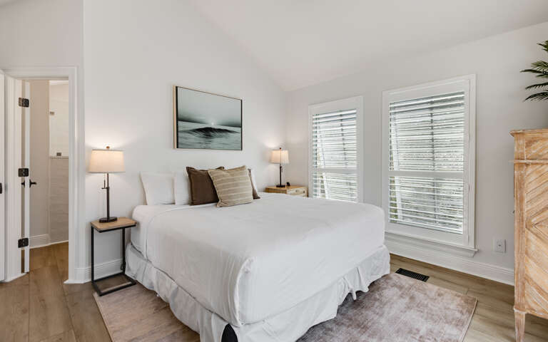 Drift into peaceful sleep in your serene bedroom, where soft linens and coastal artwork create the perfect retreat after your adventures.
