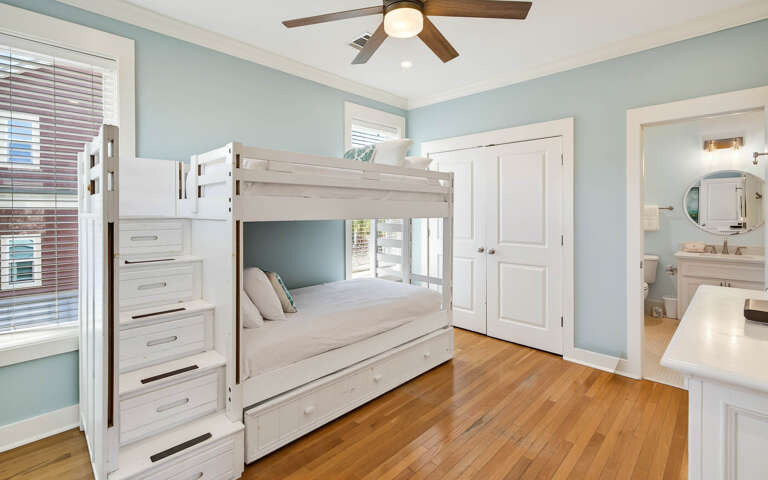 Your bunk bed bedroom offers cozy sleeping for kids with built-in storage stairs and your own private bathroom.