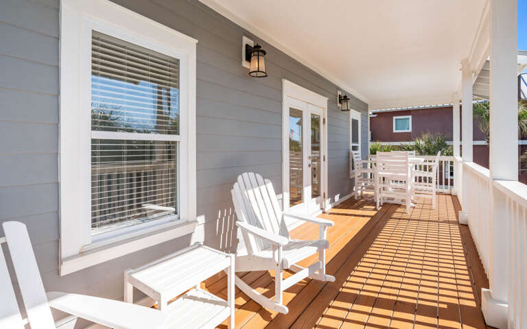Relax on your private deck with Adirondack chairs, perfect for morning coffee or evening conversations in the coastal breeze.