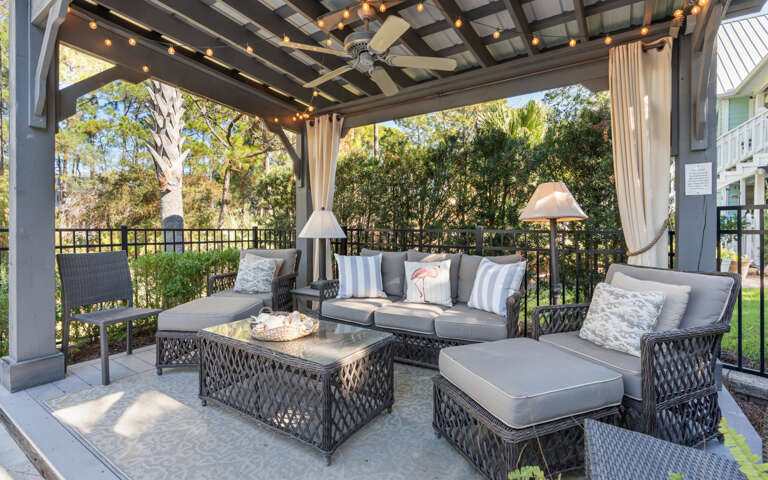 Patio With Plush Seating Shaded By A Pergola