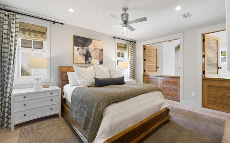 Drift into peaceful sleep in this beautifully appointed bedroom, where warm wood tones and soft linens create your perfect retreat.