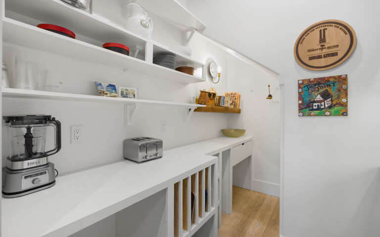 Your bright, organized pantry features everything you needâNinja blender, toaster, and stylish storage for effortless meal prep.