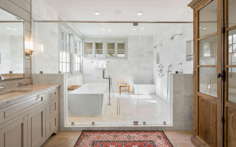 Luxurious spa-inspired bathroom with marble shower, soaking tub, and elegant finishes for your perfect retreat.