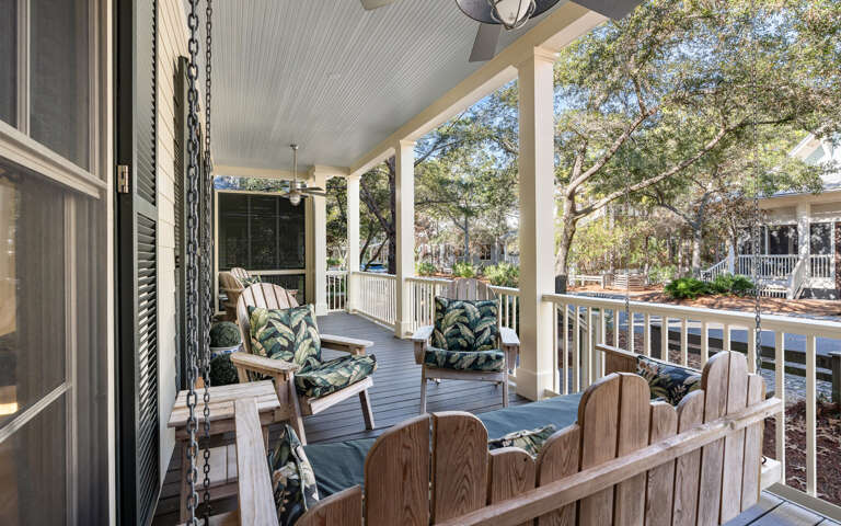 Unwind on your private covered porch with comfy seating and a gentle ceiling fan, perfect for morning coffee or evening relaxation.