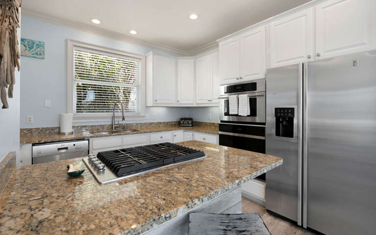 Your fully equipped kitchen features granite countertops, stainless steel appliances, and everything you need to create memorable meals during your stay.