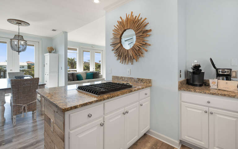 Your open-concept kitchen flows beautifully into the living space, featuring granite countertops and modern appliances for effortless meal preparation.