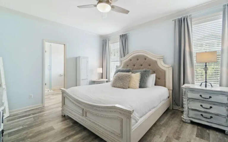 Your serene bedroom sanctuary features plush bedding and elegant furnishings, creating the perfect retreat for peaceful nights.