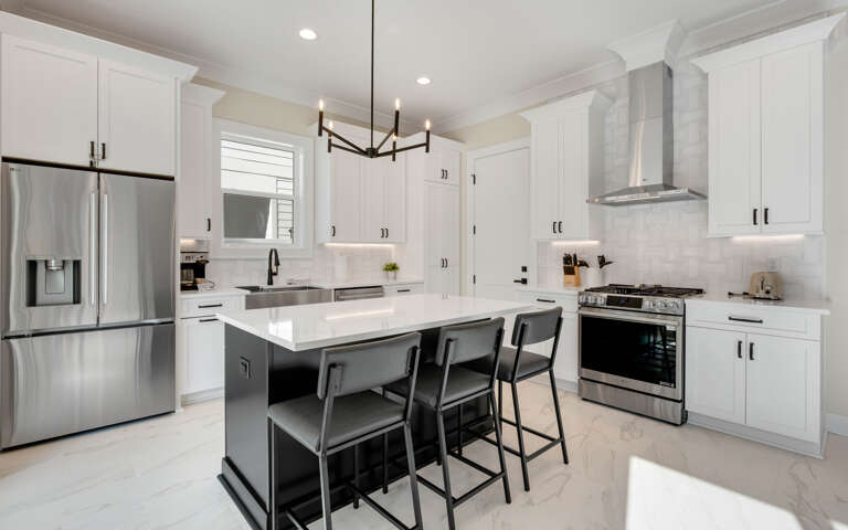 Your gourmet kitchen awaits with sleek white cabinets, granite counters, and stainless steel appliances for memorable home-cooked meals.