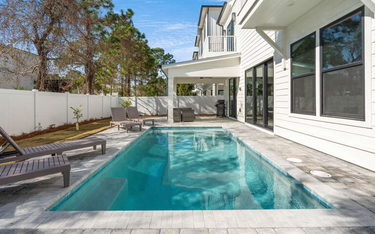 Your private pool oasis awaits with crystal-clear water and poolside loungers for ultimate relaxation.