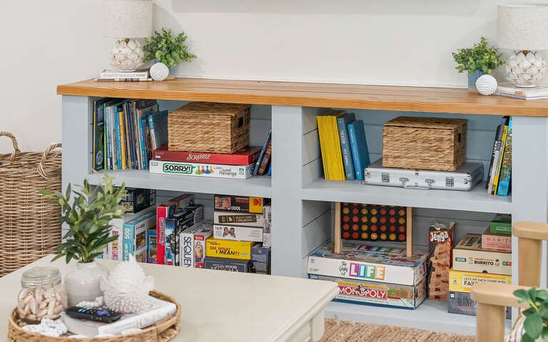 Your game room shelves are stocked with classics like Monopoly, Scrabble, and Life for cozy evenings of friendly competition.