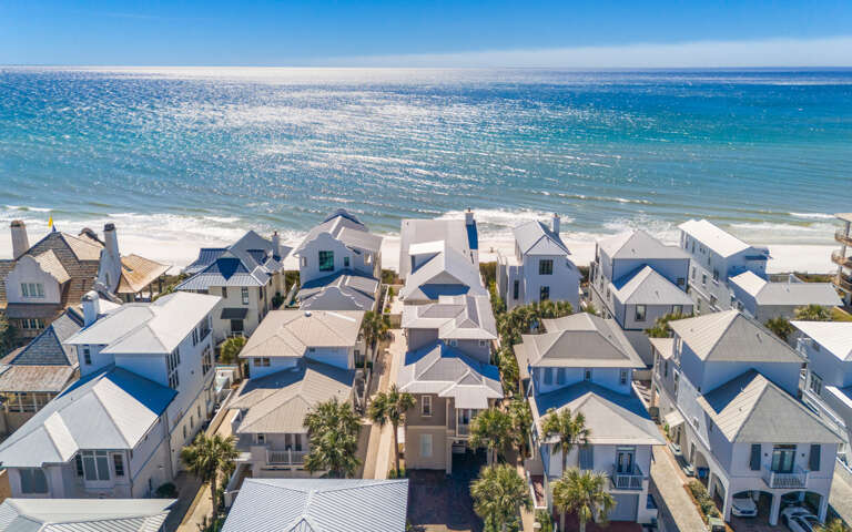 Stunning beachfront community featuring pristine white sand beach and crystal-clear turquoise waters just steps away.