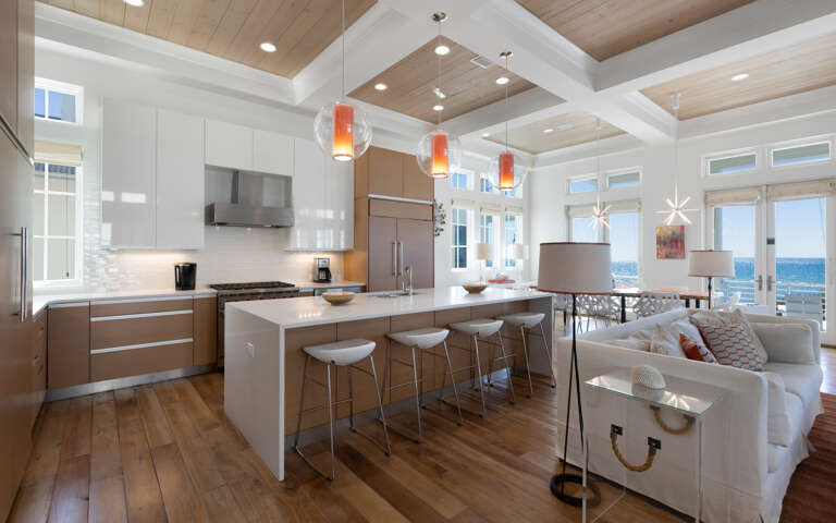 Unwind in this stunning open-concept space where modern elegance meets comfort. Your gourmet kitchen flows into cozy seating with breathtaking ocean views.