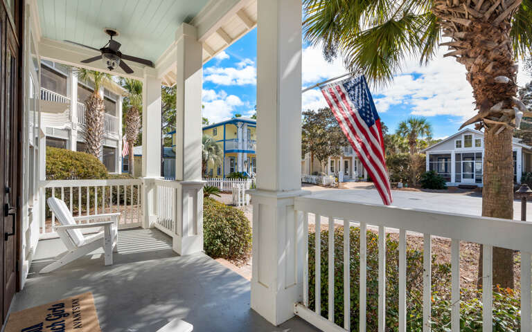 Step onto your charming front porch and feel the coastal breeze as you relax in comfortable chairs under the covered veranda.