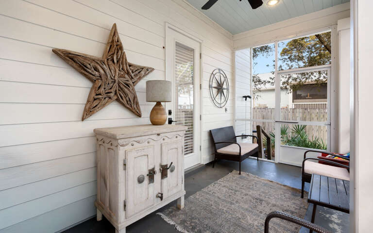 Relax in your private sunroom where rustic charm meets comfort—perfect for morning coffee or evening reading sessions.