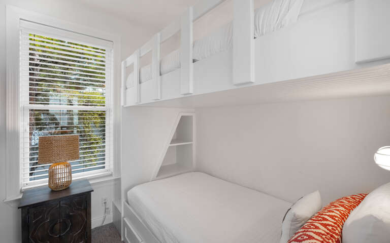Your cozy bunk room features custom built-in beds with crisp linens and smart storage, perfect for families or groups traveling together.