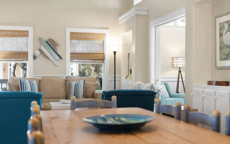 Relax in your bright, airy living space where coastal blues meet warm neutrals, creating the perfect atmosphere for peaceful moments together.