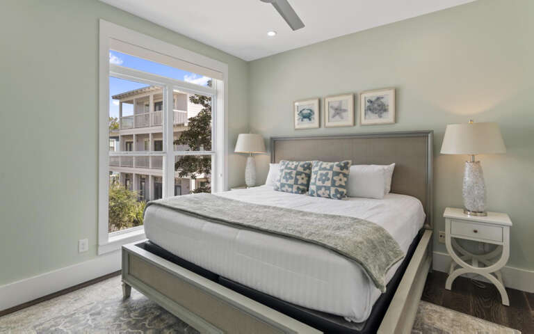 Sink into your plush bed surrounded by calming coastal colors and soft natural light streaming through your window.