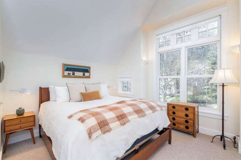 Primary Master guest suite with King bed and large bathroom.