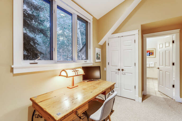 Large guest suite includes a nice desk if you have to work when you are away.