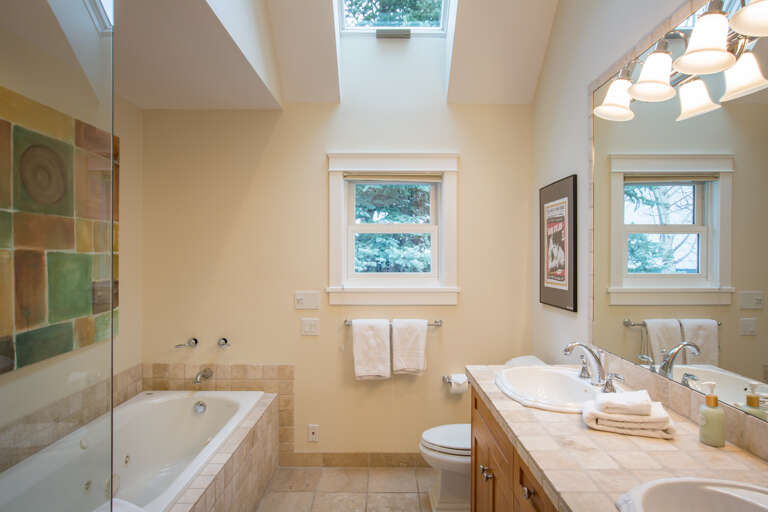 Master Bathroom steam shower, spa jetted tub and double vanity (steam shower next to tub)