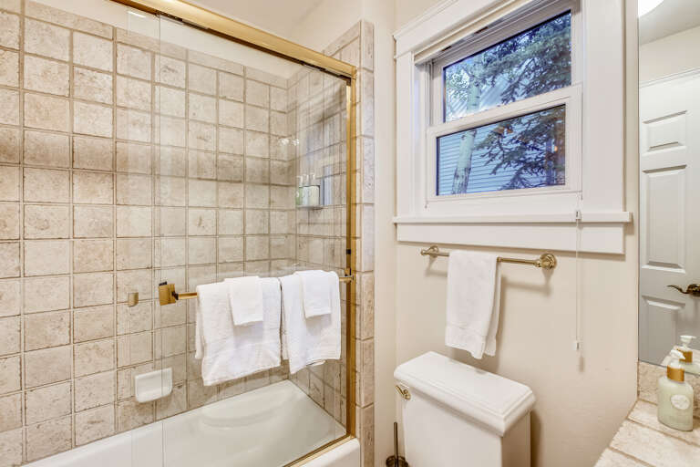 Powder room on main level and bathroom for queen guest room.