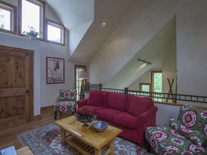 Loft living area is comfortable and cozy.