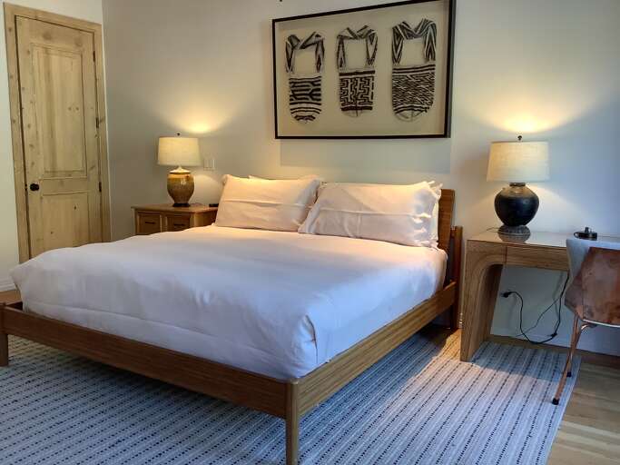 Master bedroom suite with all new linens. French doors opening to the enormous rooftop deck.