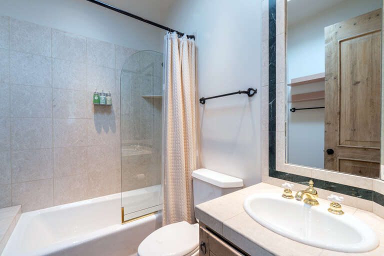 3rd full bath associated with Split King bedroom with shower/tub combo. 3rd full bath associated with Split King bedroom with shower/tub combo.